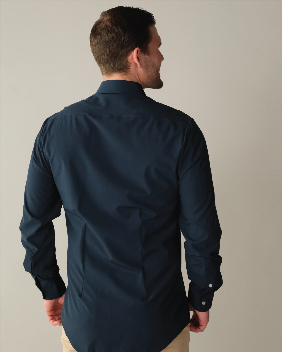 Man wearing a navy dress shirt