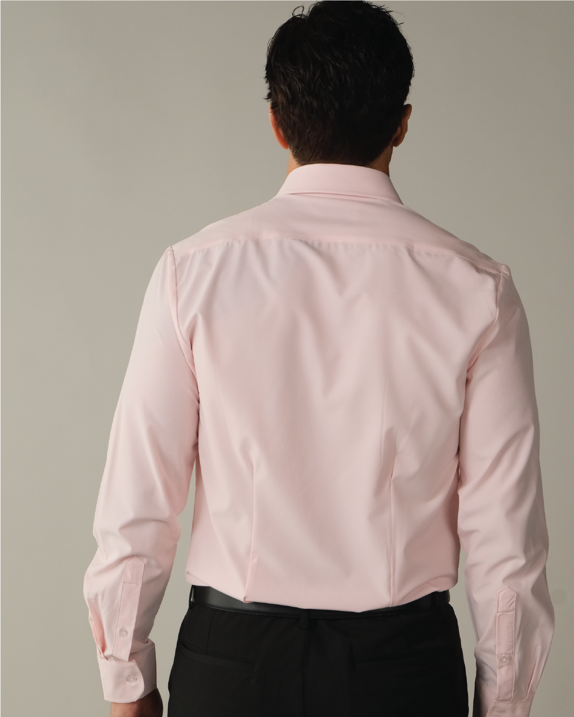 Man wearing a solid pink dress shirt