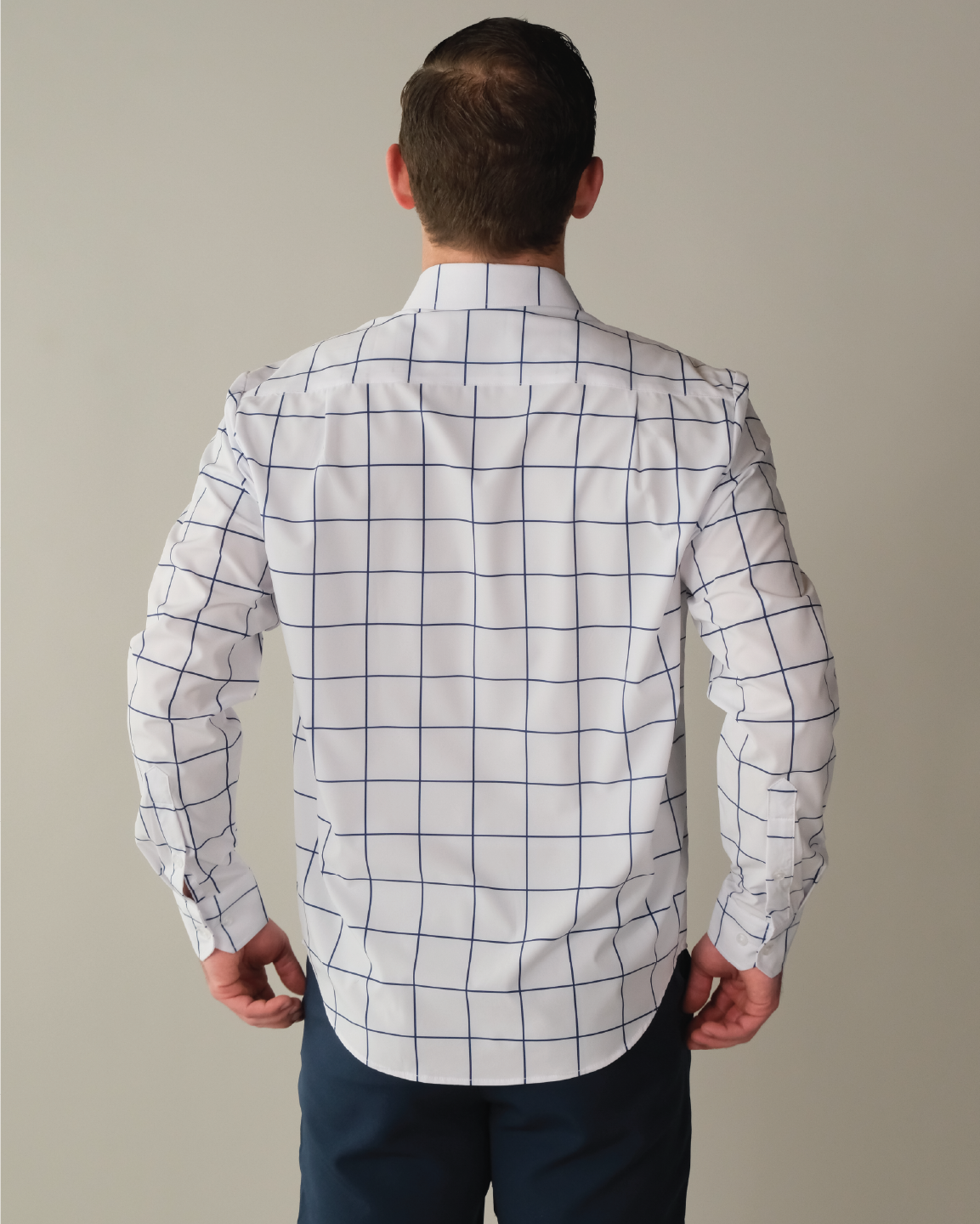 Man wearing a white shirt with navy windowpane
