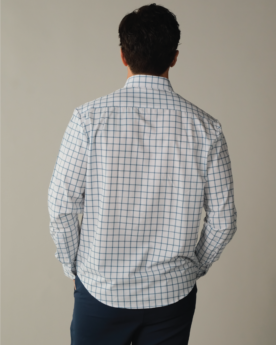 Man wearing white with ocean blue windowpane shirt