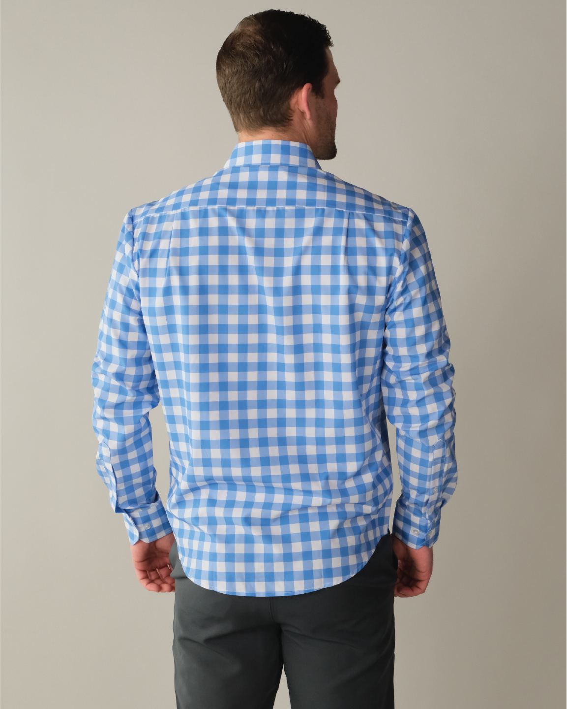 Man wearing ocean Blue shirt with White Large Gingham