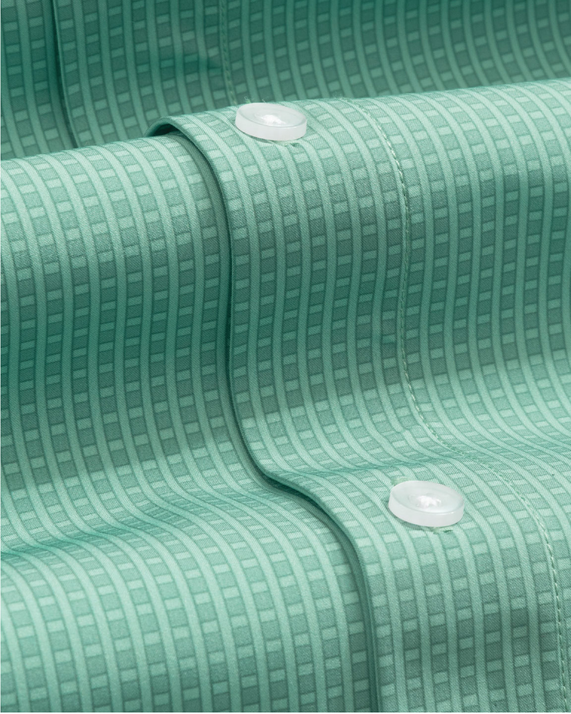 Close-up of a green shirt w/grids