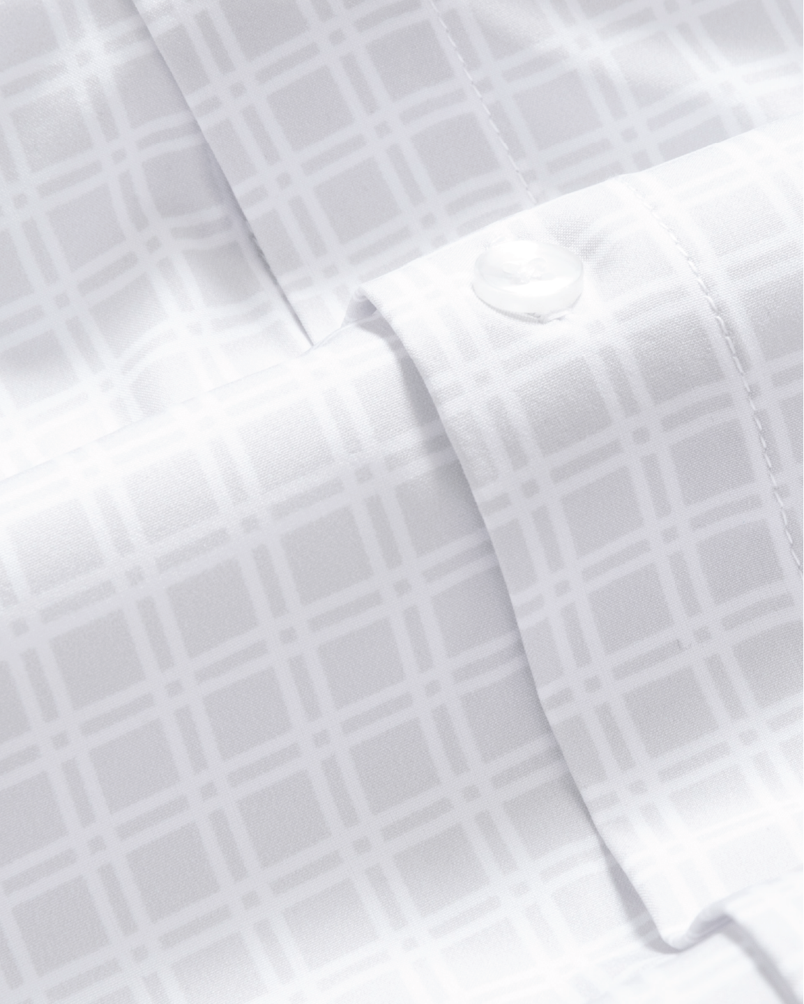Close up of grey shirt with small white windowpane