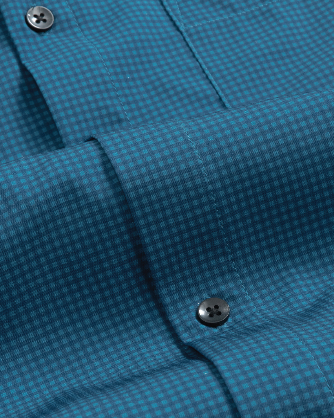 Close up dark blue with navy check shirt. Black buttons
