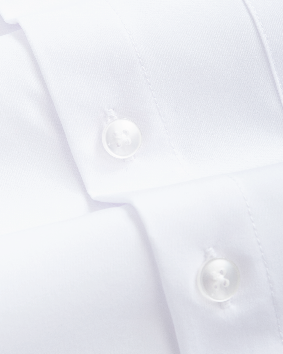 Fabric closeup of kids white dress shirt