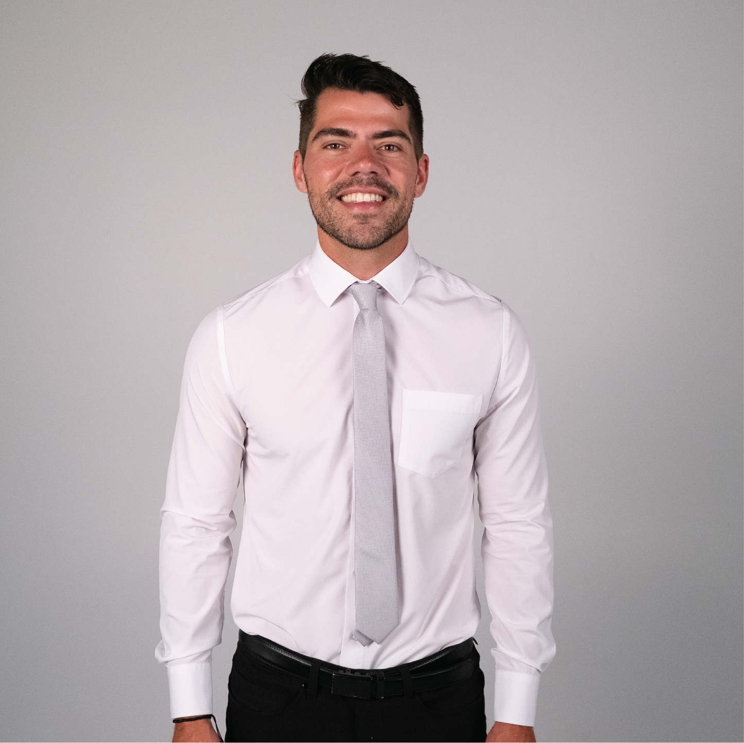 Light gray textured tie on a white dress shirt