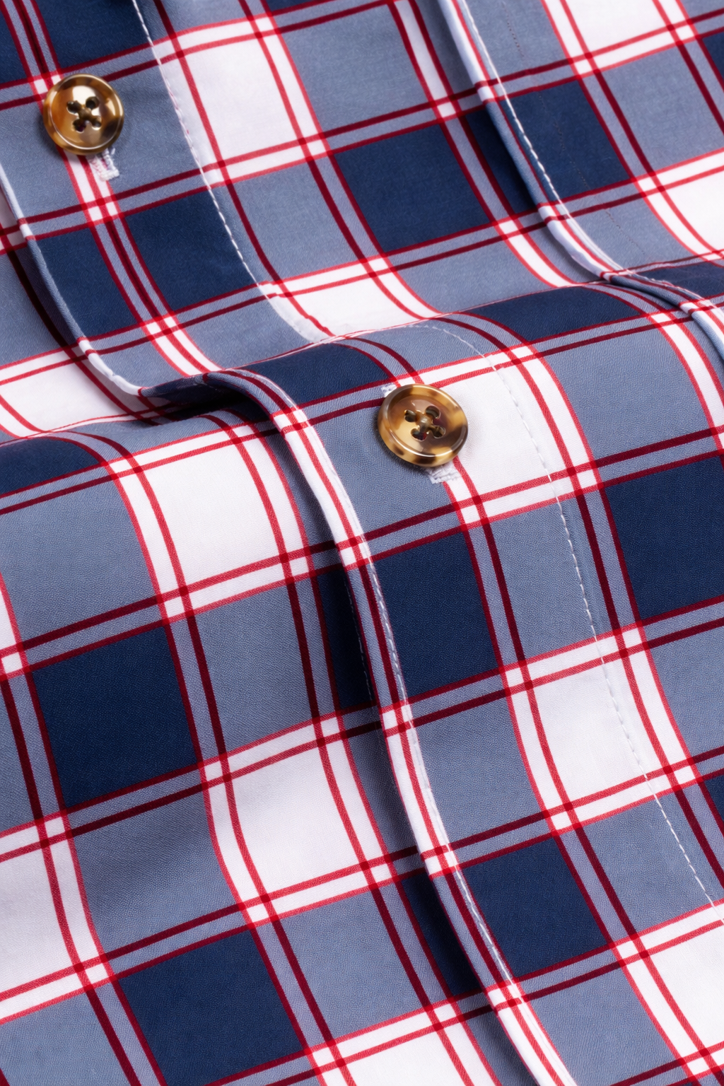 Close-up detail of the Range Shirt in white and navy with red accents