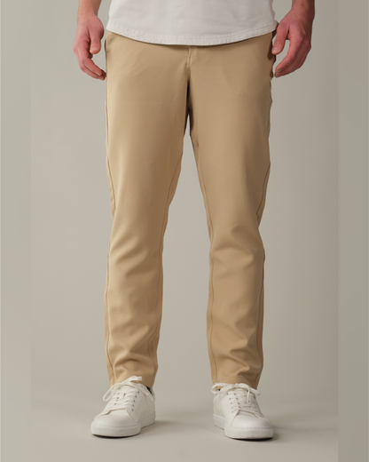 Person wearing desert khaki pants and white sneakers