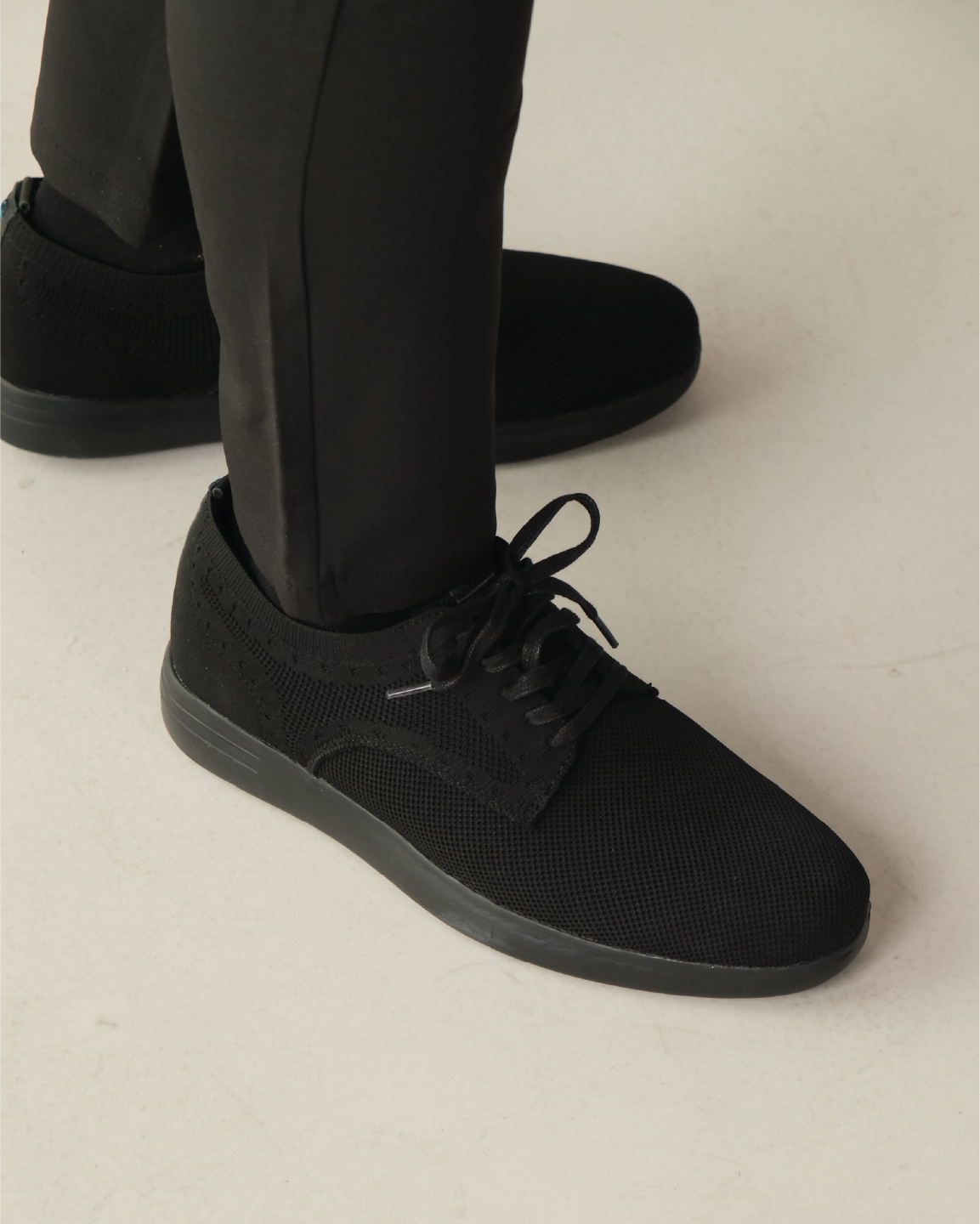 Black shoes worn with black pants
