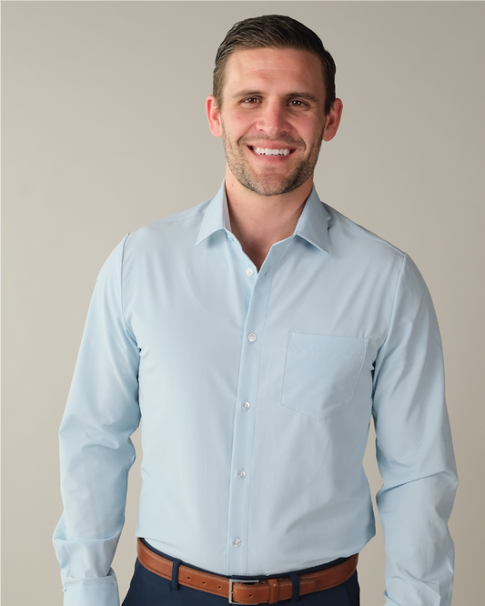 Man wearing a pale blue dress shirt