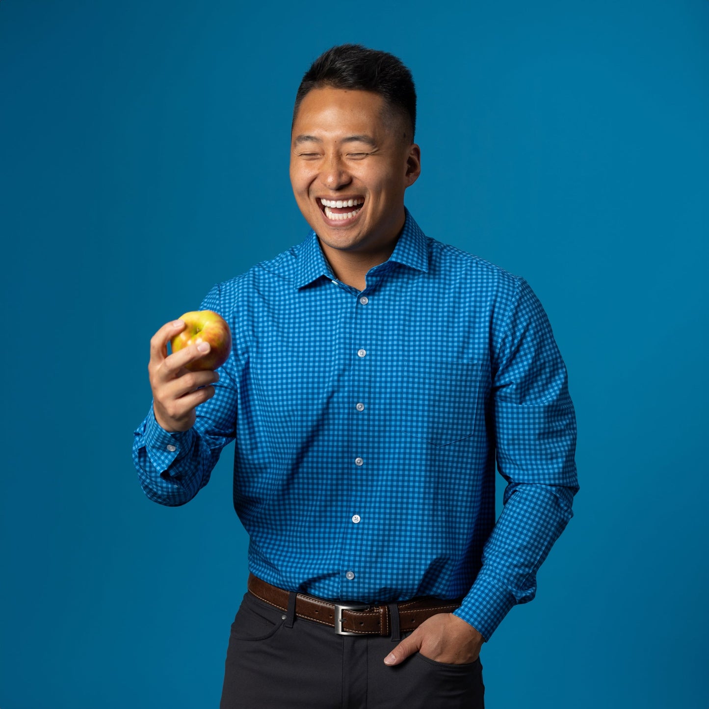 Man wearing navy and royal blue gingham shirt
