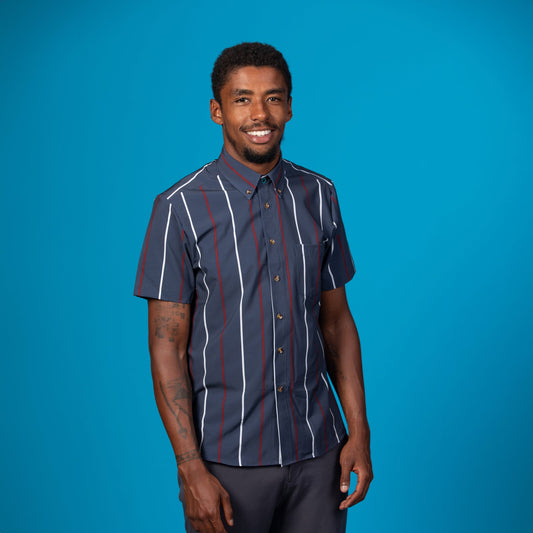 Man wearing a navy shirt with red and white stripes