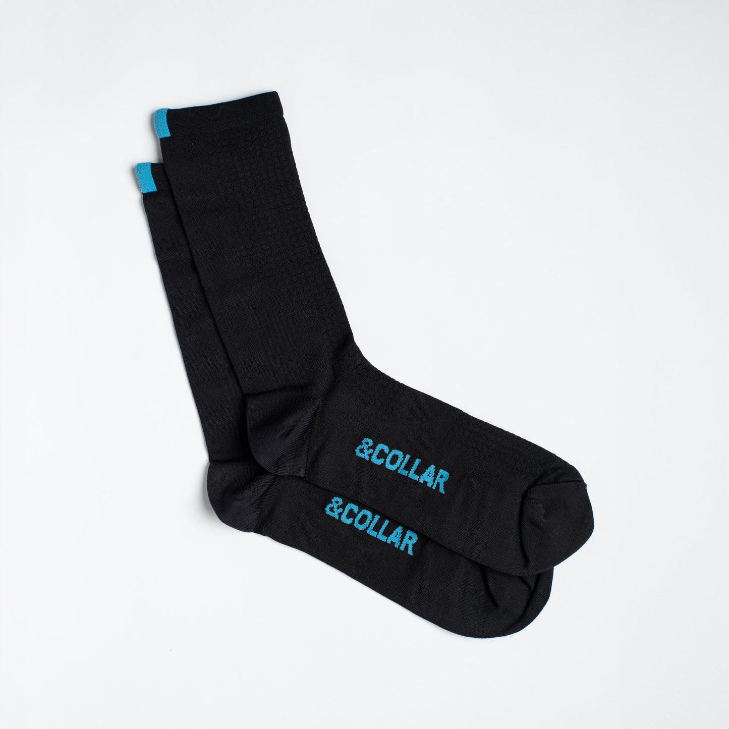 Black dress socks with light blue &Collar logo on the arch of the sock