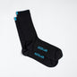 Black dress socks with light blue &Collar logo on the arch of the sock