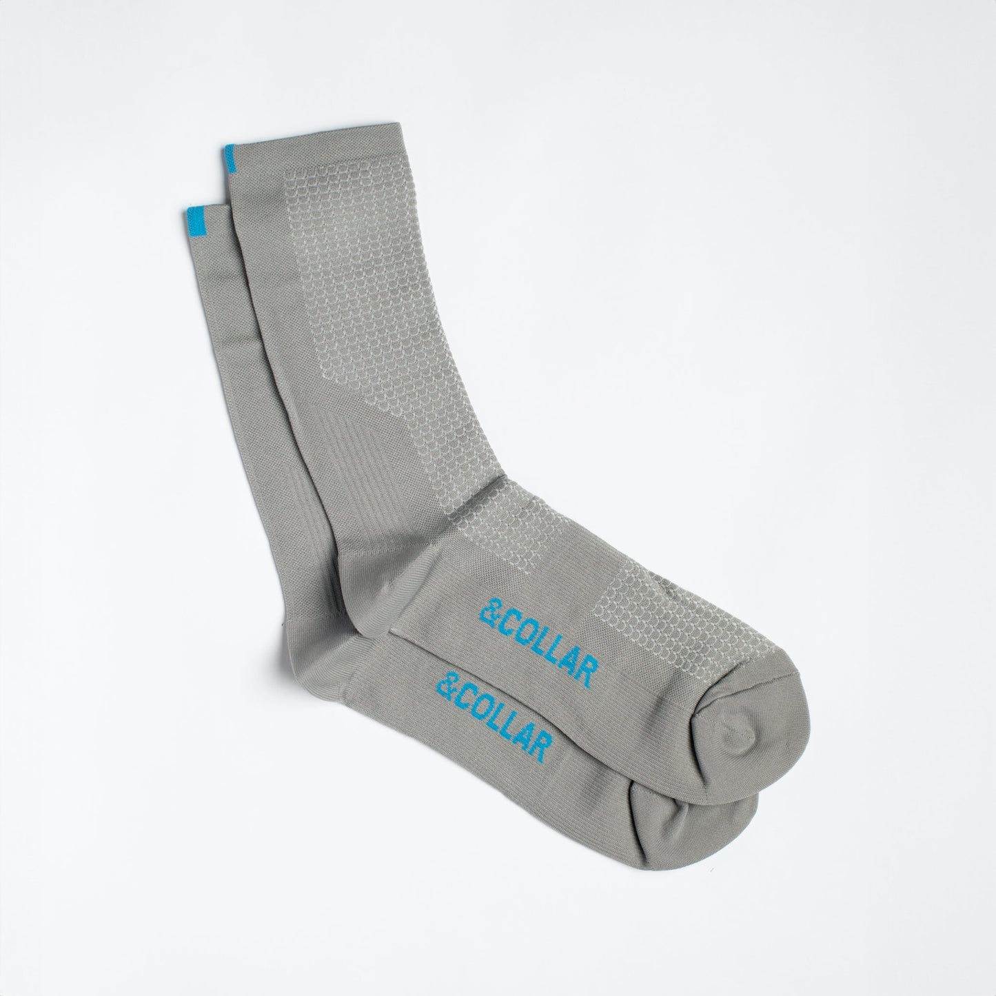 Grey dress socks with light blue &Collar logo on the arch of the foot