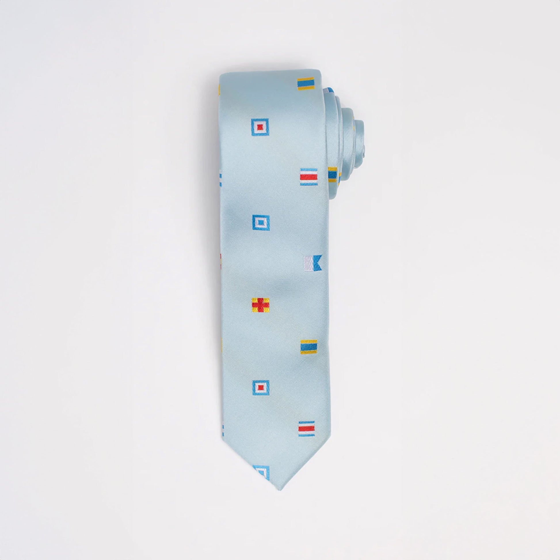 Light blue tie with colorful flag patterns