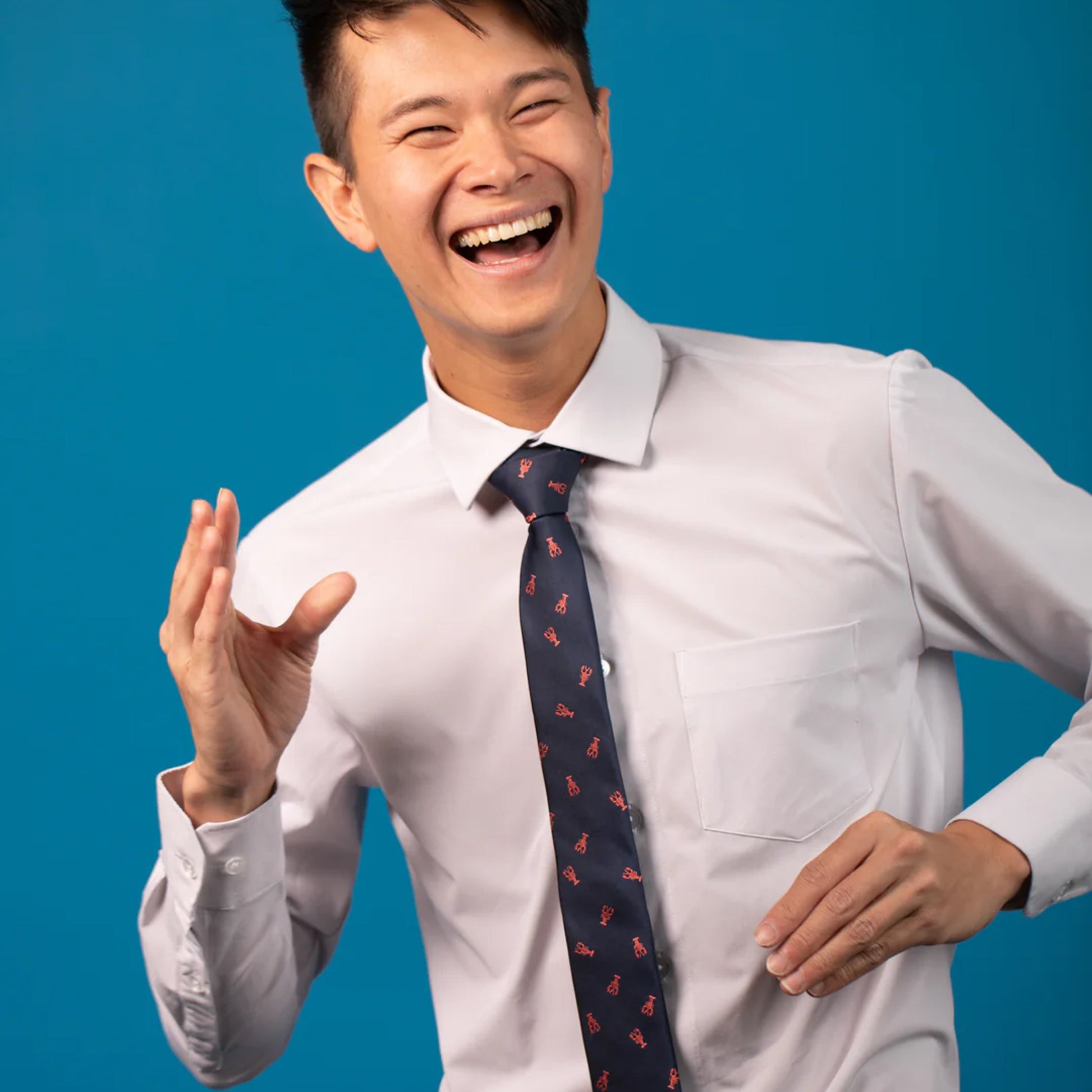 Navy blue tie with red lobsters on a white shirt
